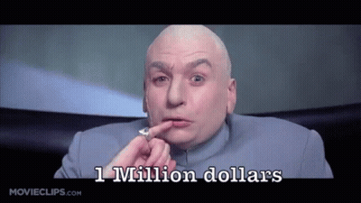 A Bald Man In A Blue Suit Is Holding A Coin In His Hand And Says 1 Million Dollars GIF
