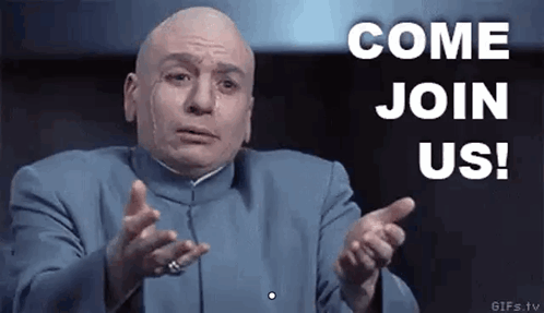 A Bald Man In A Blue Suit Is Pointing At The Camera And Saying `` Come Join Us ! '' GIF