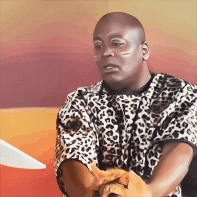 A Bald Man In A Leopard Print Shirt Holds A Cat GIF