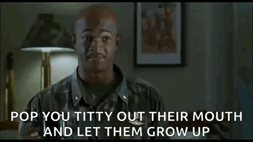 A Bald Man In A Military Uniform Is Standing In Front Of A Lamp And A Lamp . GIF