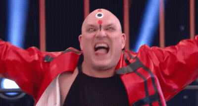 A Bald Man In A Red Jacket Has A Circle On His Forehead GIF