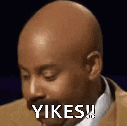 A Bald Man In A Suit And Tie Is Making A Funny Face And Saying Yikes ! GIF