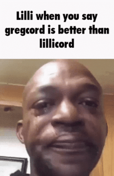 A Bald Man Is Crying While Making A Funny Face . GIF