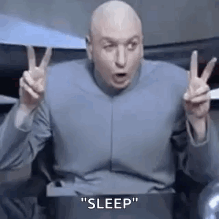 A Bald Man Is Giving A Peace Sign With His Hands . GIF