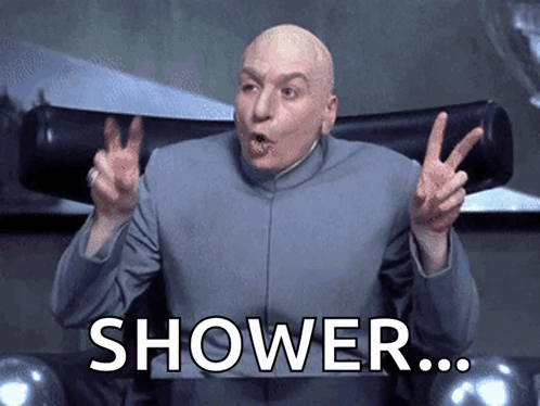 A Bald Man Is Giving A Peace Sign With The Word Shower Written Below Him GIF