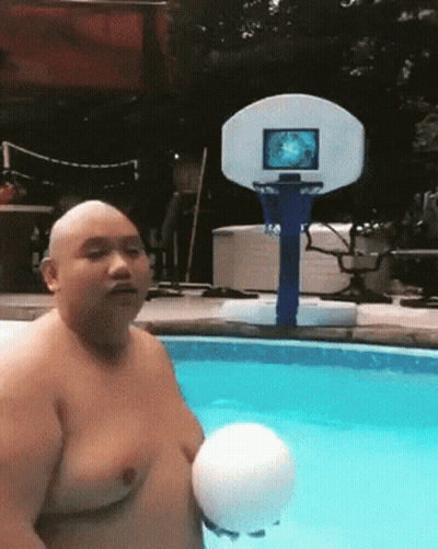 A Bald Man Is Holding A Volleyball In A Swimming Pool With A Basketball Hoop In The Background GIF