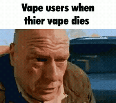 A Bald Man Is Looking At The Camera With The Words `` Vape Users When Thier Vape Dies '' . GIF