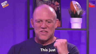 A Bald Man Is Making A Fist And Saying `` This Just '' In Front Of A Purple Background . GIF