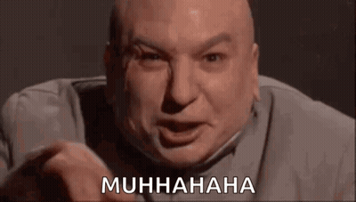 A Bald Man Is Making A Funny Face And Pointing At The Camera With The Words `` Muhhaha '' . GIF