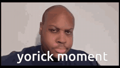 A Bald Man Is Making A Funny Face With The Words Yorick Moment Written On The Bottom . GIF