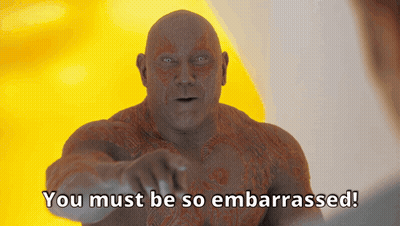 A Bald Man Is Pointing At The Camera With The Words You Must Be So Embarrassed Below Him GIF