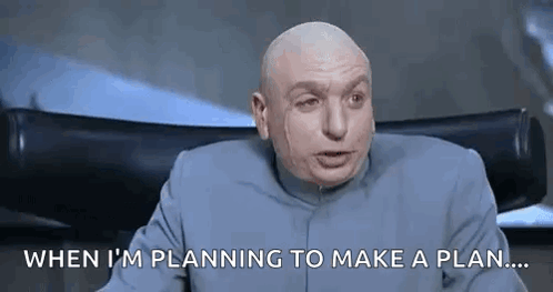 A Bald Man Is Sitting In A Chair And Saying `` When I 'M Planning To Make A Plan . `` GIF