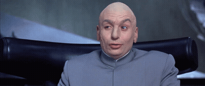 A Bald Man Is Sitting In A Chair With His Mouth Open GIF