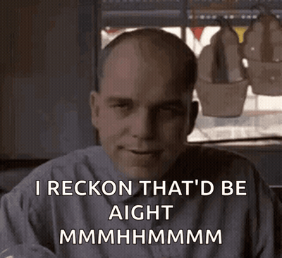 A Bald Man Is Sitting In Front Of A Window And Says I Reckon That 'D Be Aight GIF