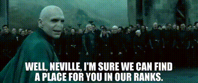 A Bald Man Is Standing In Front Of A Crowd And Says Well Neville I 'M Sure We Can Find A Place GIF