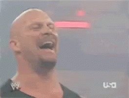 A Bald Man Is Standing In Front Of A U-T Logo GIF