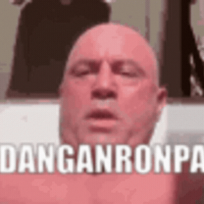 A Bald Man Is Taking A Selfie With His Eyes Closed And The Words `` Danganronpa '' Written On His Face . GIF
