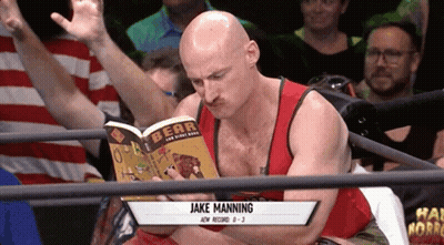 A Bald Man Reading A Book Called Bear GIF