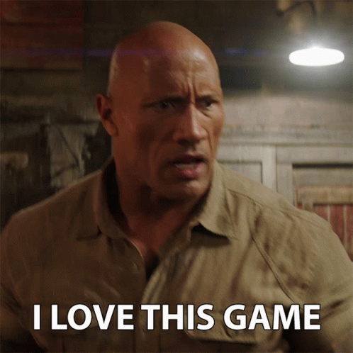 A Bald Man Says I Love This Game In Front Of A Light GIF