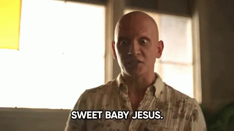 A Bald Man Says Sweet Baby Jesus While Looking At The Camera GIF