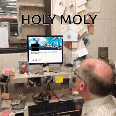 A Bald Man Sits At A Desk Looking At A Computer Screen That Says Holy Moly On It GIF