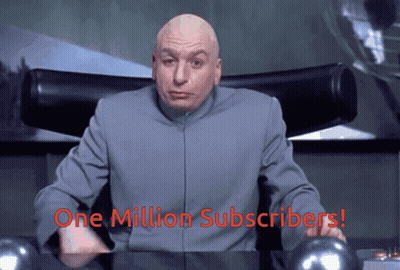 A Bald Man Sitting At A Desk With The Words " One Million Subscribers " On The Bottom GIF