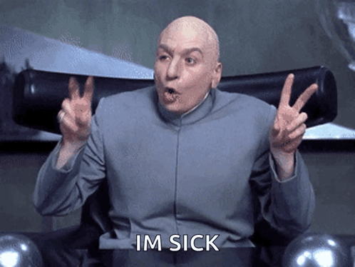 A Bald Man Sitting In A Chair Making A Peace Sign And The Words Im Sick Below Him GIF