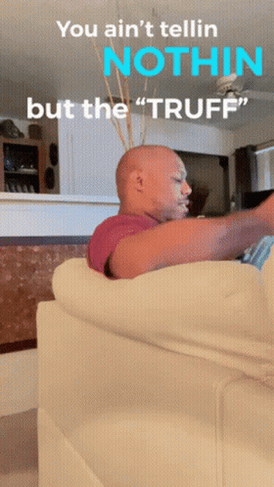 A Bald Man Sitting On A Couch With The Words " You Ain 'T Tellin Nothin But The Tuff " GIF