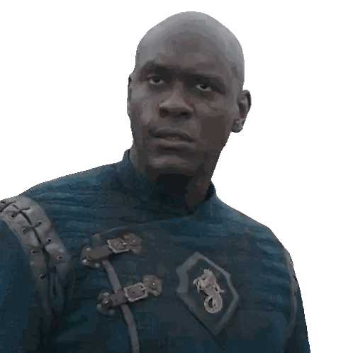 A Bald Man Wearing A Blue Shirt With A Horse Emblem On His Chest Sticker