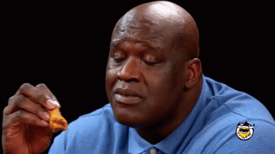 A Bald Man Wearing A Blue Shirt With A Shark On It GIF