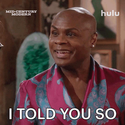 A Bald Man Wearing A Pink And Blue Robe Says I Told You So GIF