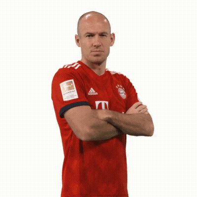 A Bald Man Wearing A Red Adidas Jersey Stands With His Arms Crossed GIF