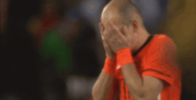 A Bald Man Wearing An Orange Shirt With The Number 11 On The Front GIF