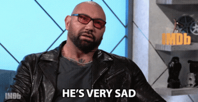A Bald Man Wearing Glasses And A Leather Jacket Is Saying He 'S Very Sad GIF