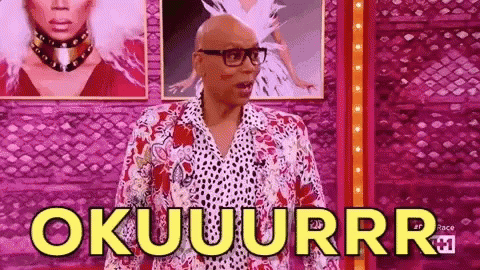 A Bald Man Wearing Glasses And A Leopard Print Shirt Is Standing In Front Of A Wall And Says Okuuurrr . GIF