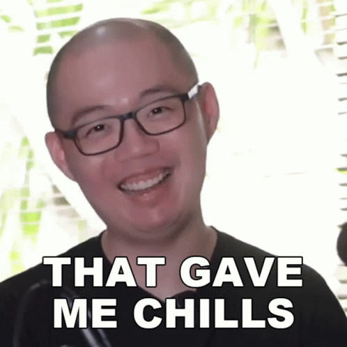 A Bald Man Wearing Glasses Is Smiling With The Words That Gave Me Chills Below Him GIF