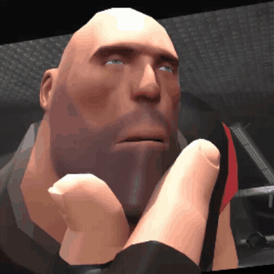 A Bald Man With A Beard And Blue Eyes Is Holding His Hand To His Chin GIF