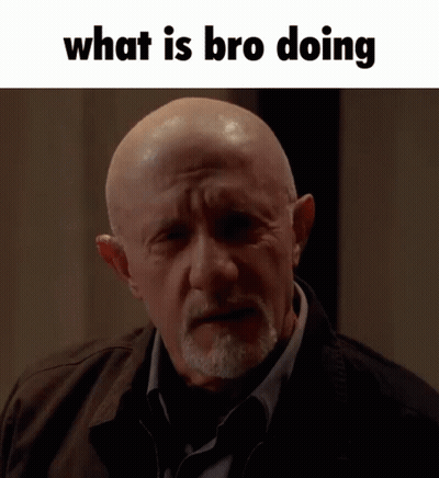 A Bald Man With A Beard And The Words " What Is Bro Doing " Below Him GIF