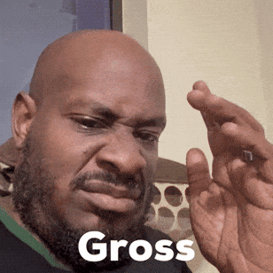 A Bald Man With A Beard Is Holding Something In His Hand And The Word Gross Is On His Face GIF