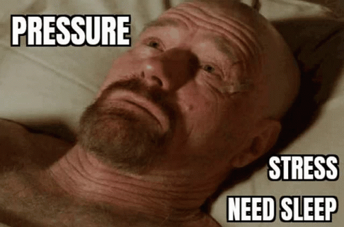 A Bald Man With A Beard Is Laying On A Bed With The Words Pressure Stress Need Sleep Above His Head . GIF