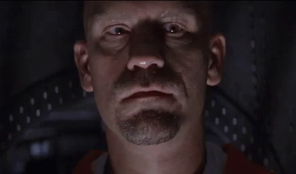 A Bald Man With A Beard Is Saying Welcome To Con Air GIF
