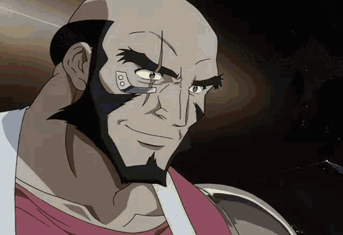 A Bald Man With A Beard Is Smiling And Looking At Something GIF