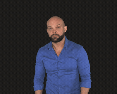 A Bald Man With A Beard Is Wearing A Blue Shirt And A Smart Watch GIF