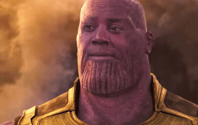 A Bald Man With A Beard Is Wearing A Gold Armor .. GIF