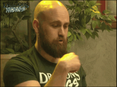 A Bald Man With A Beard Wearing A Dragons Things Shirt GIF