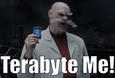 A Bald Man With A Mustache Is Holding A Card And Says Terabyte Me GIF