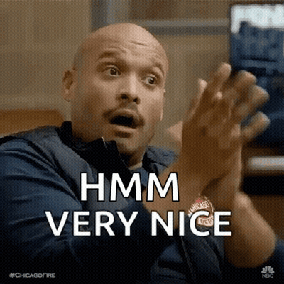 A Bald Man With A Surprised Look On His Face Is Clapping His Hands And Saying Hmm Very Nice GIF