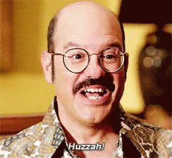 A Bald Man With Glasses And A Mustache Says Huzzah GIF