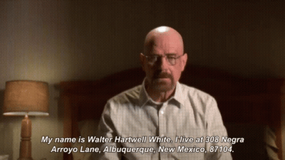 A Bald Man With Glasses And A Mustache Says " My Name Is Walter Hartwell White " In Front Of A Bed GIF