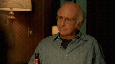 A Bald Man With Glasses Is Holding A Bottle Of Beer And Saying Eh GIF